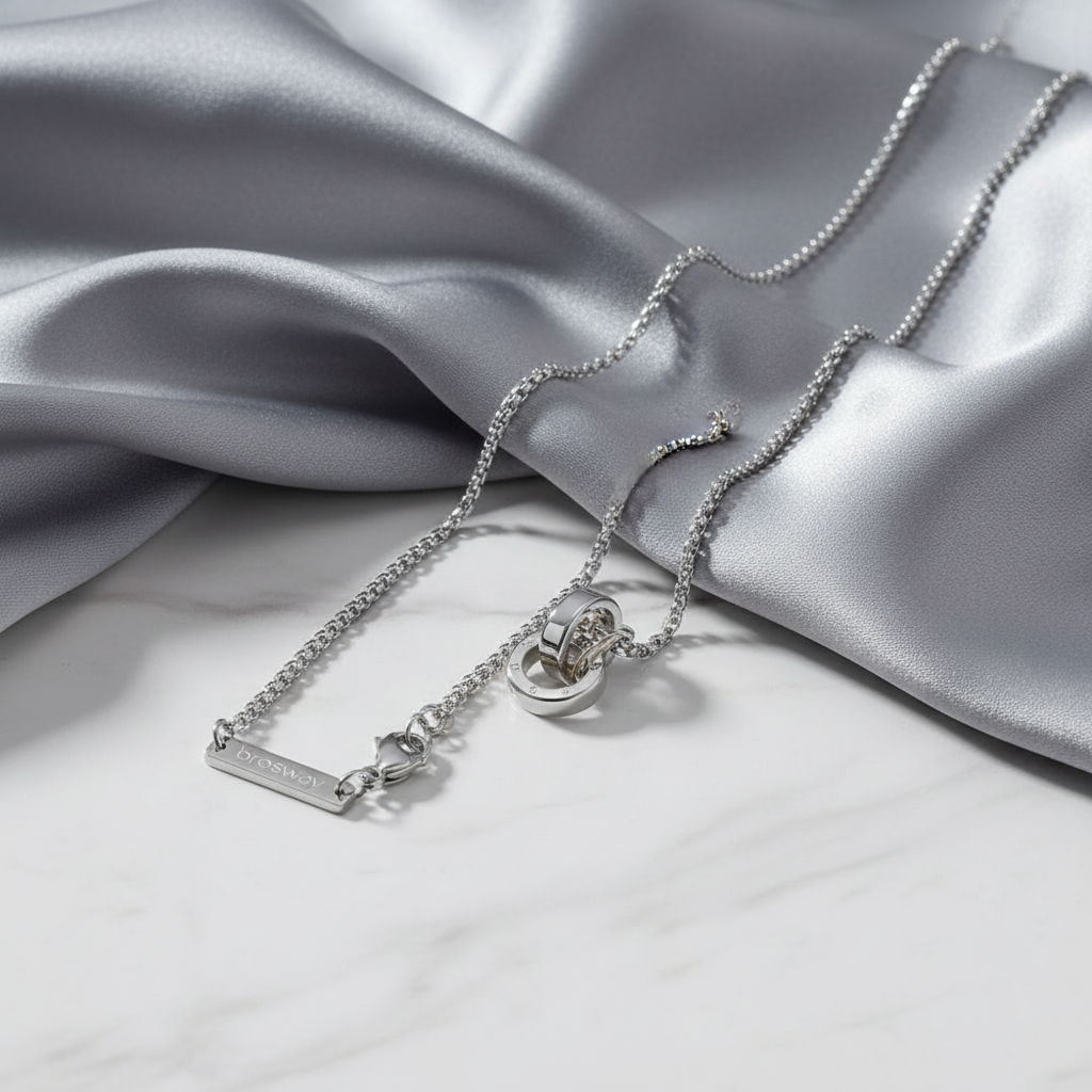 Infinity Circle Pendant Necklace on gray silk and white marble