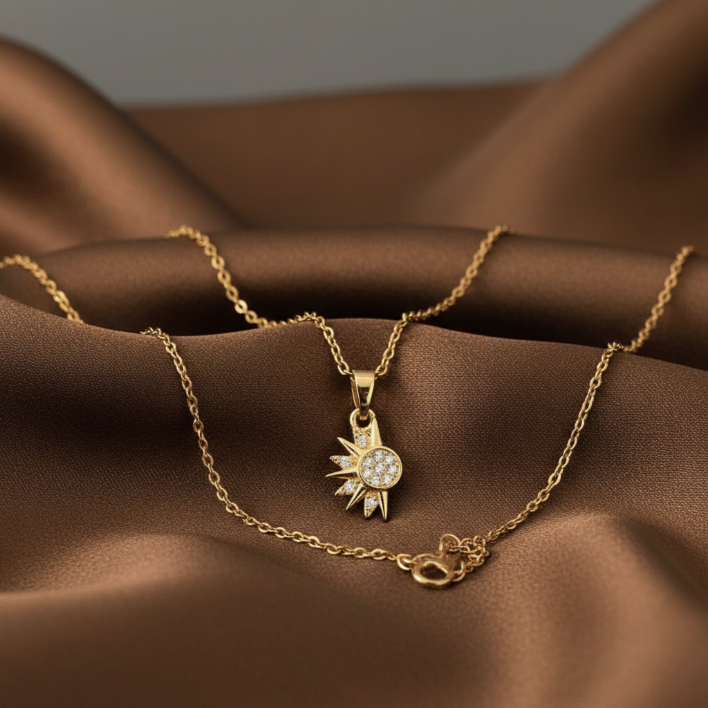 Sol y Luna gold sun and moon pendant necklace on brown silk